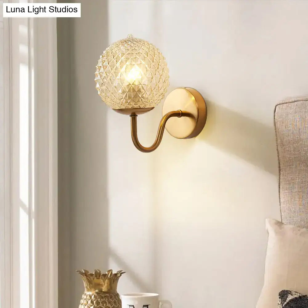 Postmodern gold ball shaped wall sconce with textured glass shade bedroom light