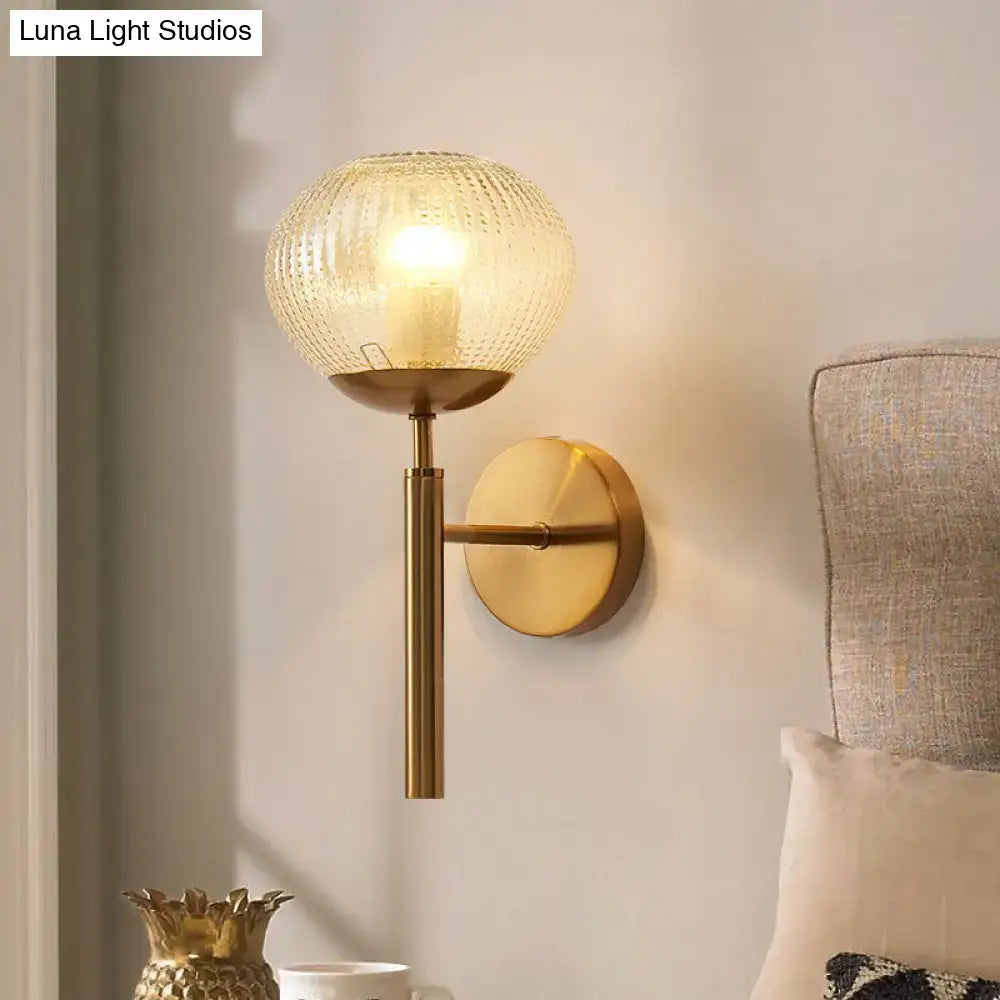 Postmodern gold ball shaped wall sconce with textured glass shade bedroom light
