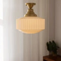 Ribbed cream glass and brass pendant light for dining room