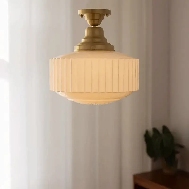 Ribbed cream glass and brass pendant light for dining room