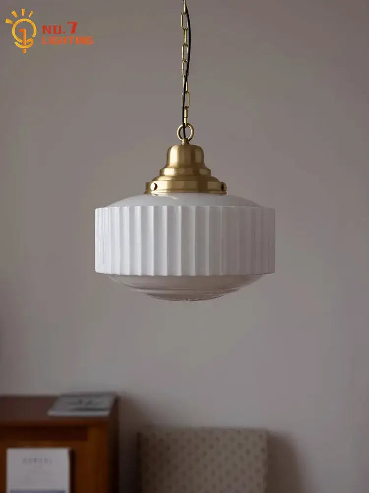 Ribbed cream glass and brass pendant light for dining room