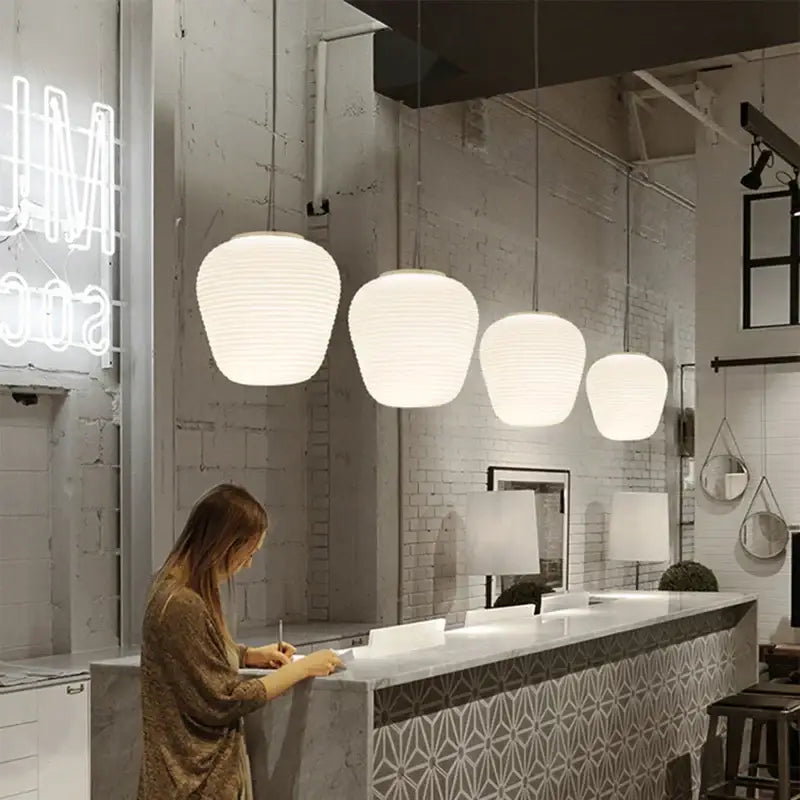Ribbed off-white glass cocoon pendant light for dining room