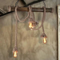 Rustic industrial wood and rope island pendant light dining room