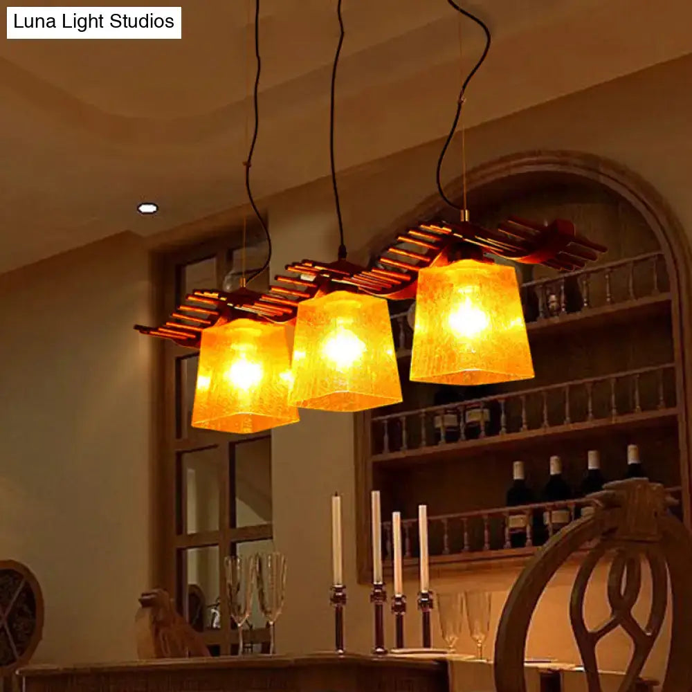 Rustic wood dining room pendant with yellow crackle glass shades