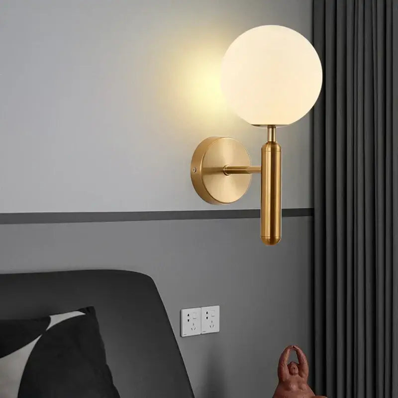 Sleek brass glass sphere wall sconce lamp – corridor lighting