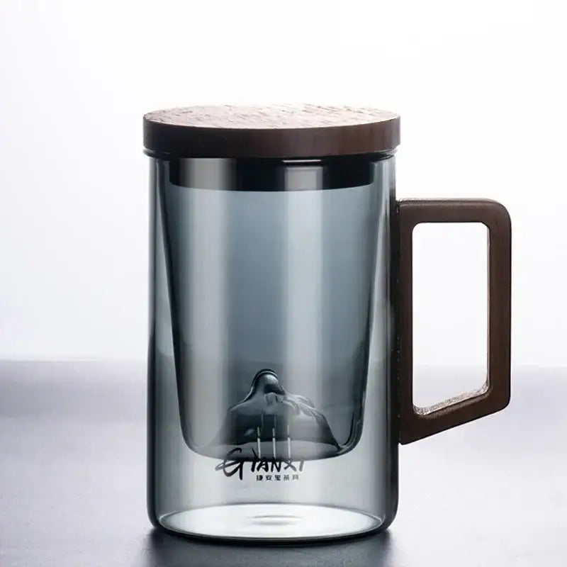 Sleek dark gray double walled glass tea cup with wooden lid kitchen