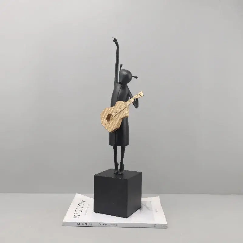 Stylized black and gold guitarist resin figure – living room decor