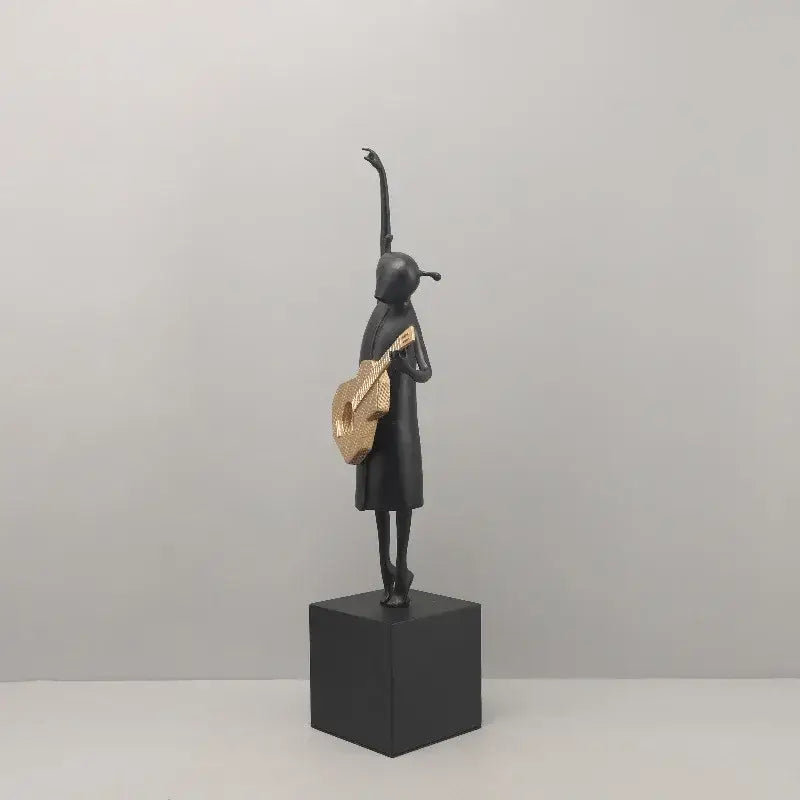 Stylized black and gold guitarist resin figure – living room decor