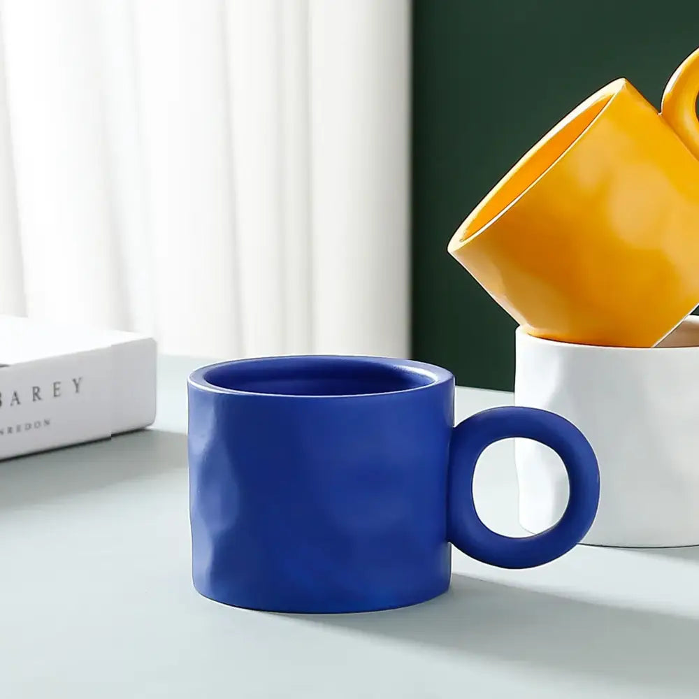 Textured blue ceramic coffee mug kitchen cup with round handle