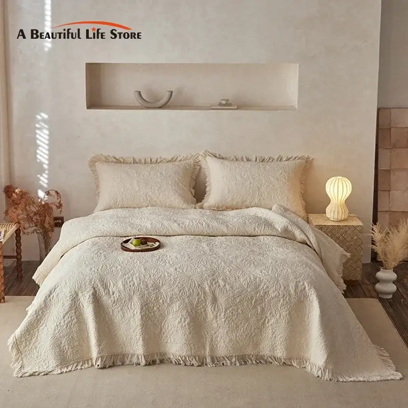 Textured cream cotton quilted bedspread set for bedroom with fringes