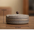 Textured green ceramic ashtray with wooden lid for office or living room