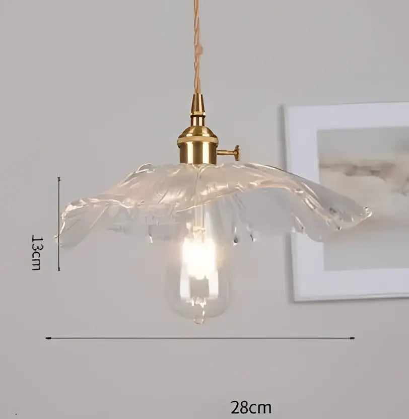 Translucent blue glass pendant light with brass fixture for dining room