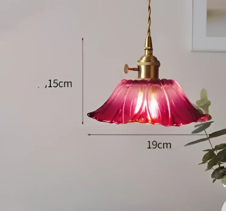 Translucent blue glass pendant light with brass fixture for dining room