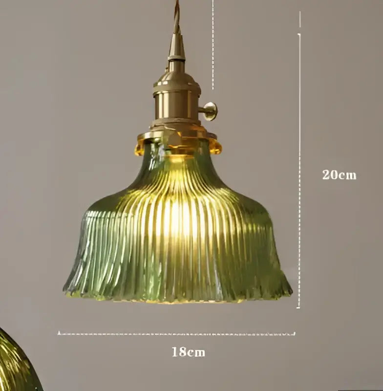 Translucent blue glass pendant light with brass fixture for dining room