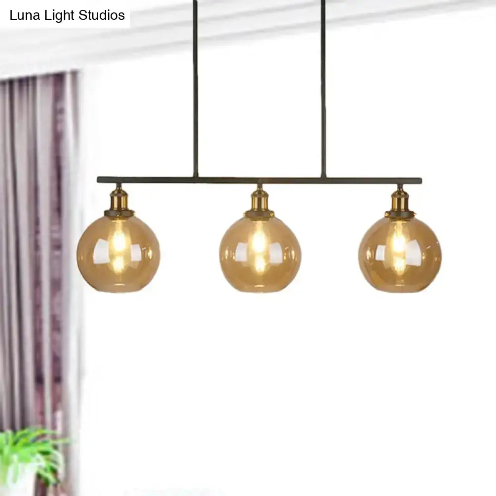 Vintage amber glass 3-light black and brass pendant dining room lamp