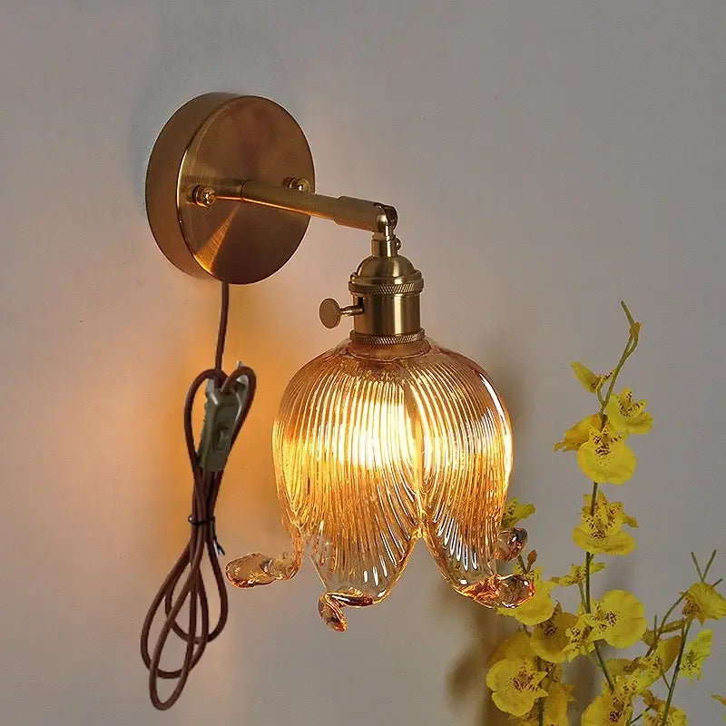 Vintage brass and amber glass wall light bedroom flower sconce