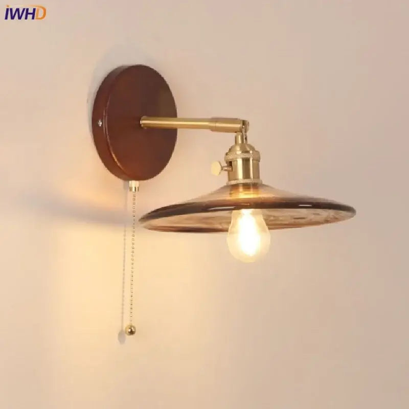 Vintage brass and amber glass wall sconce stair light with pull chain