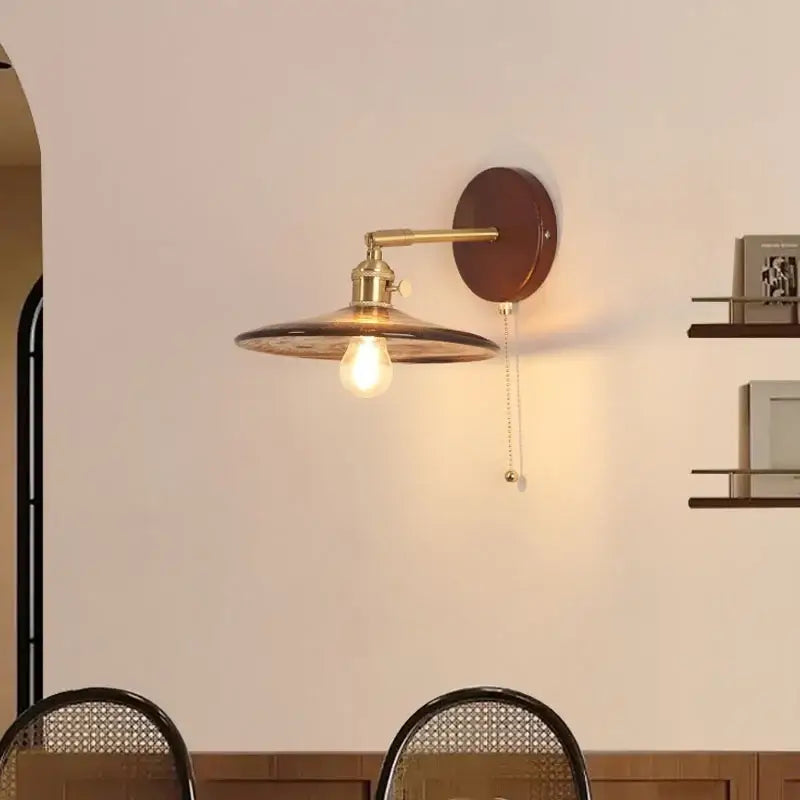 Vintage brass and amber glass wall sconce stair light with pull chain