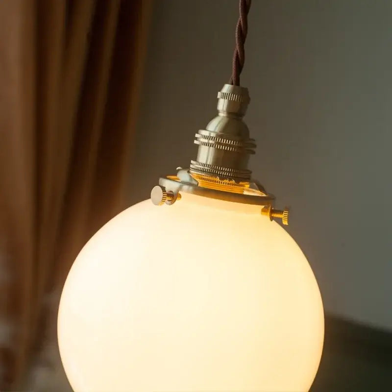 Vintage brass and cream glass ball pendant light for kitchen
