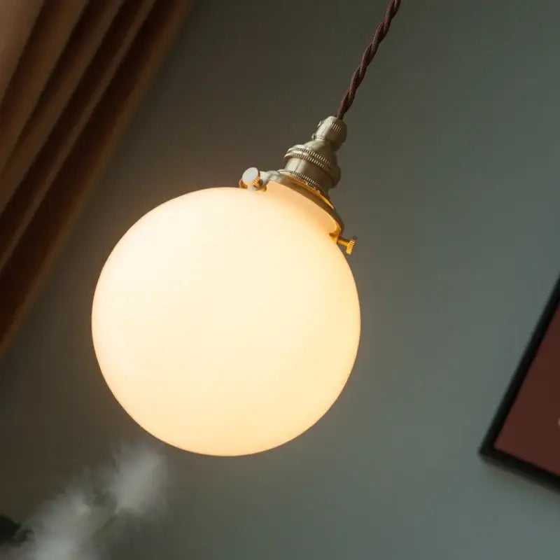 Vintage brass and cream glass ball pendant light for kitchen