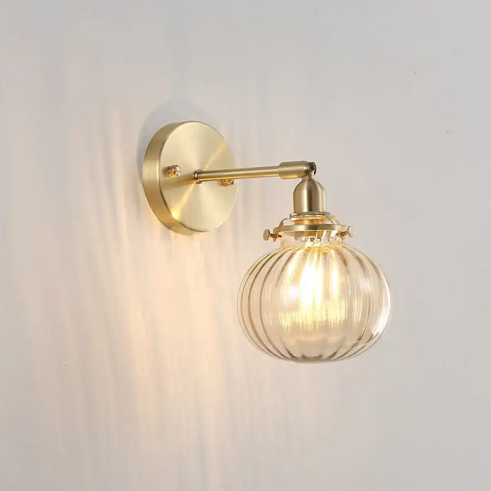 Vintage brass wall light with champagne & clear glass shade bedroom