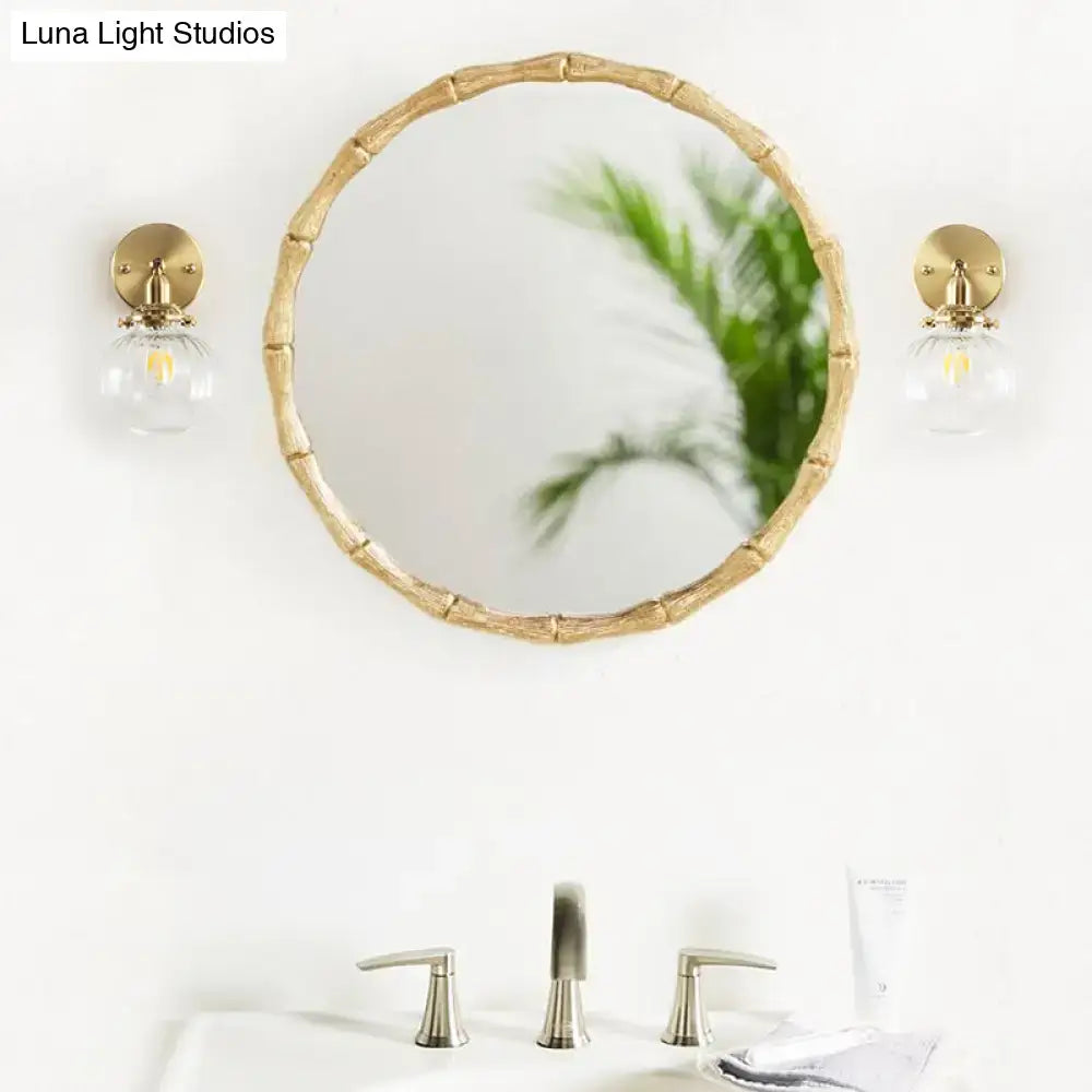 Vintage brass wall light with champagne & clear glass shade bedroom
