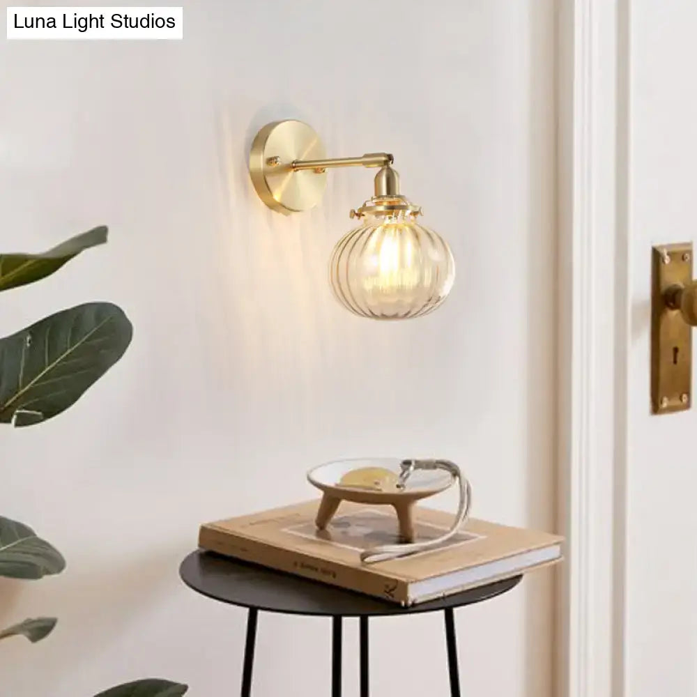 Vintage brass wall light with champagne & clear glass shade bedroom