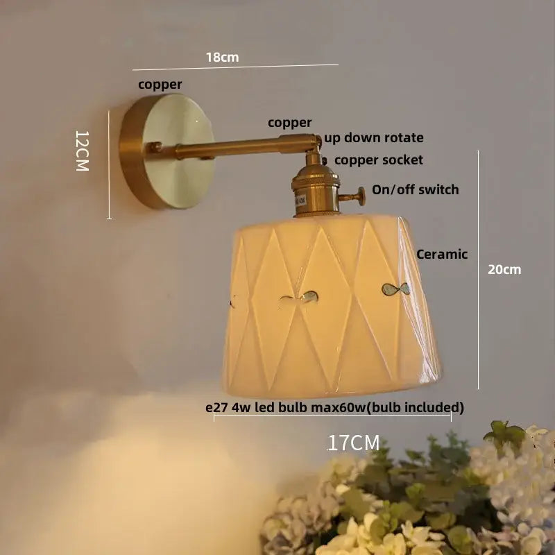 Vintage brass wall light with ribbed glass and knob switch bedroom