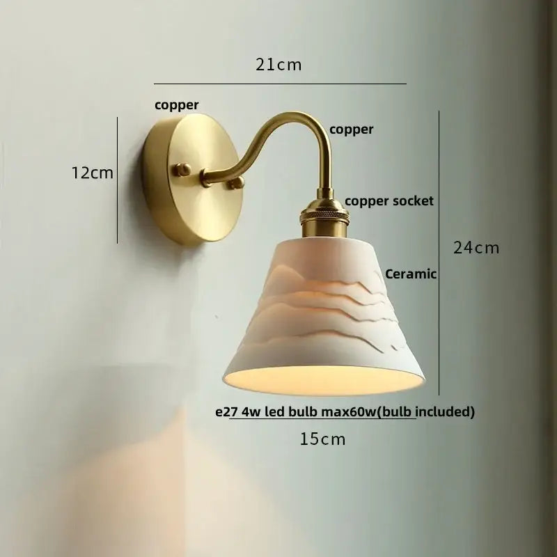 Vintage brass wall sconce with scalloped clear glass for stairways
