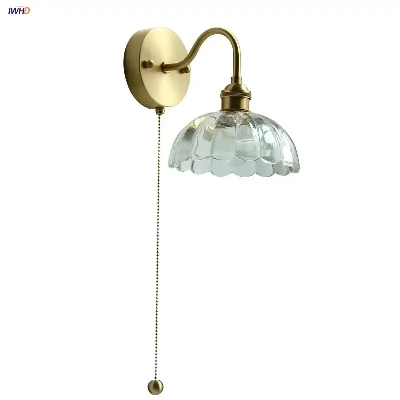 Vintage brass wall sconce with scalloped clear glass for stairways
