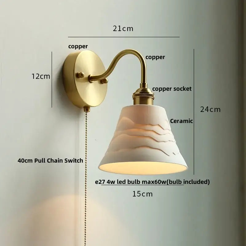 Vintage brass wall sconce with scalloped clear glass for stairways