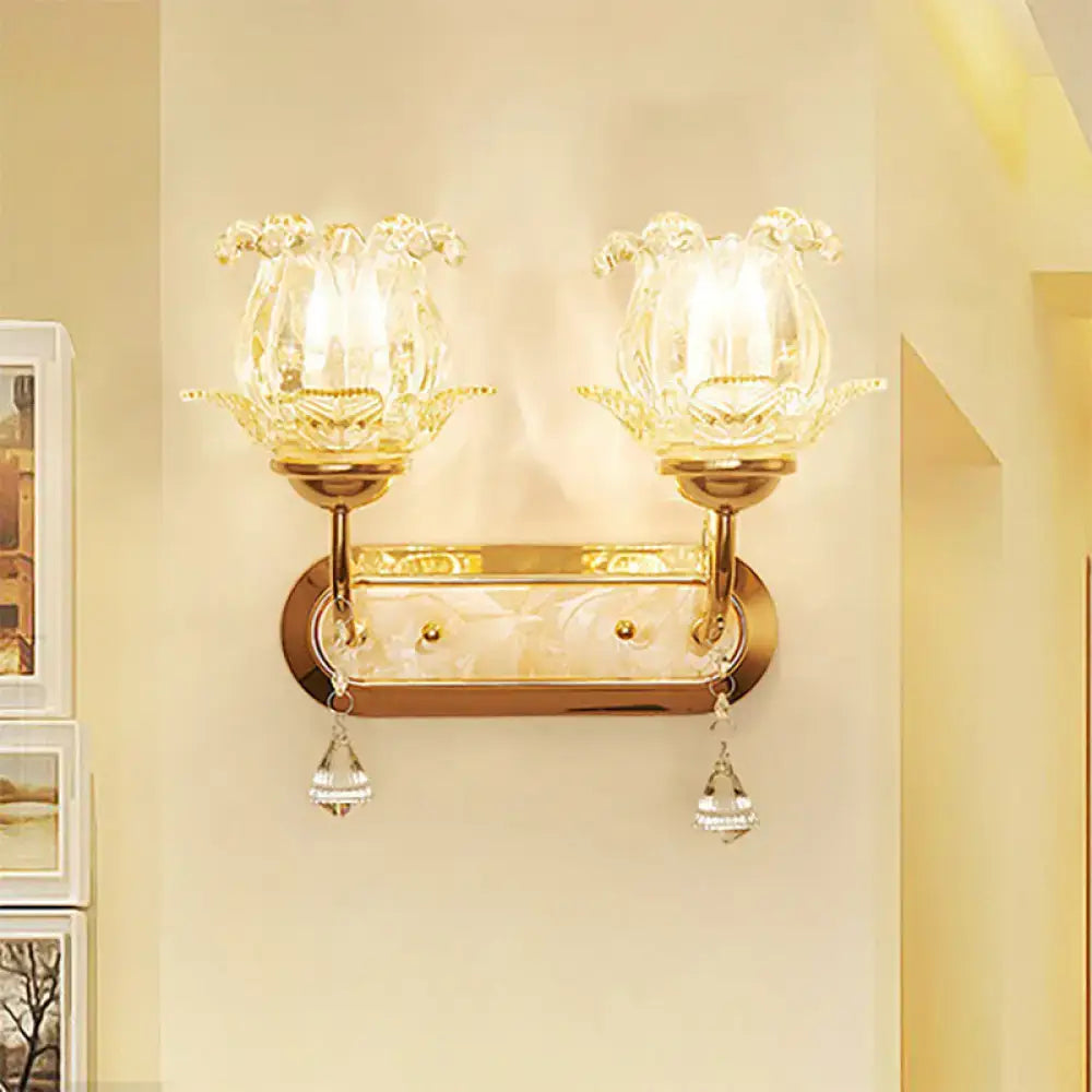 Vintage gold flower wall sconce with amber glass shade bedroom light