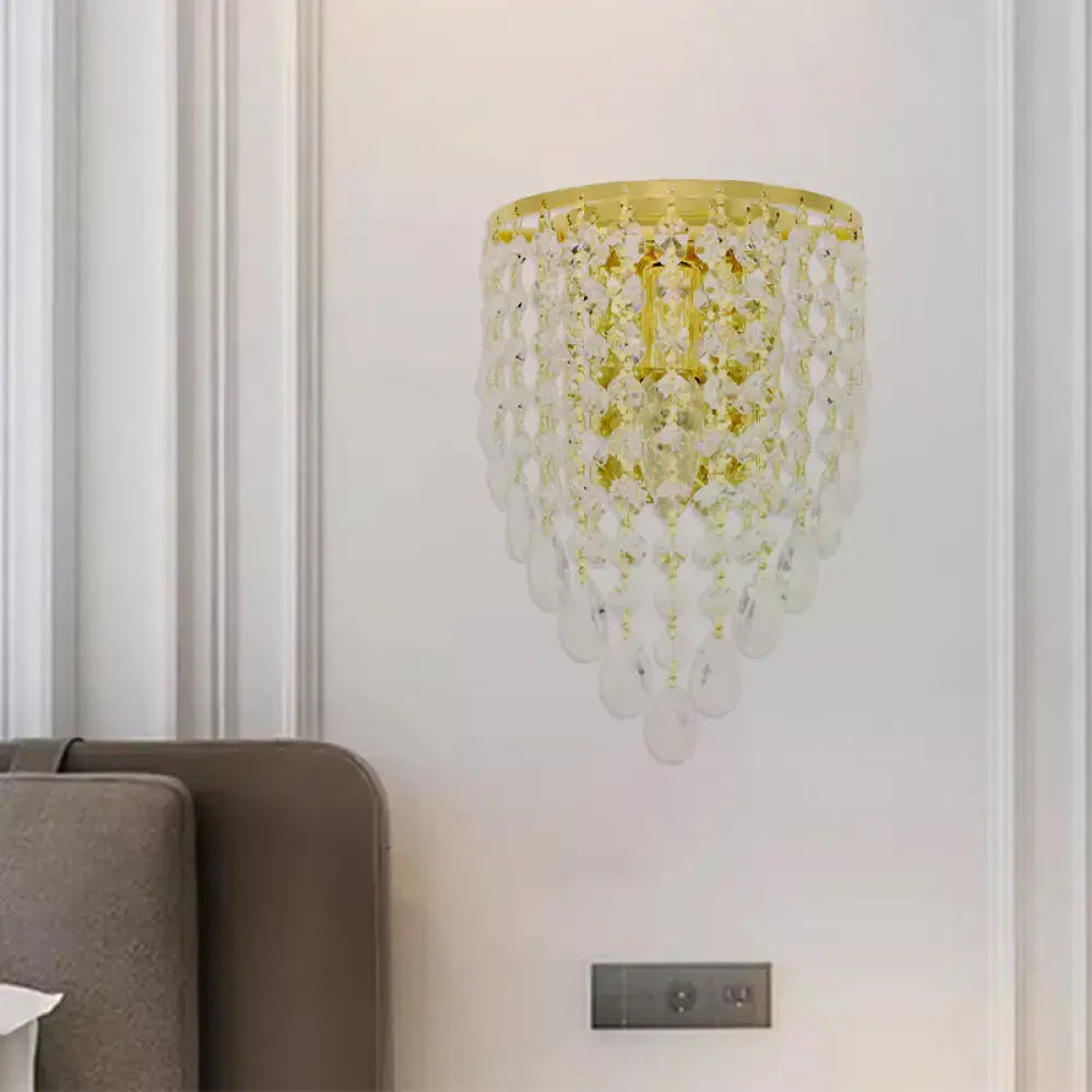 Vintage gold tapered wall mount with clear crystal draping bedroom light