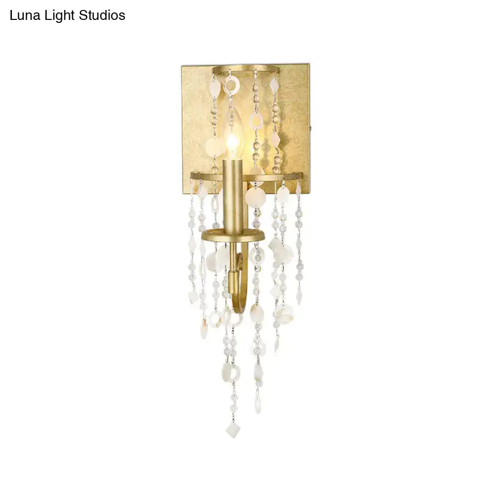 Vintage style gold wall sconce with crystal beaded strand bedroom light