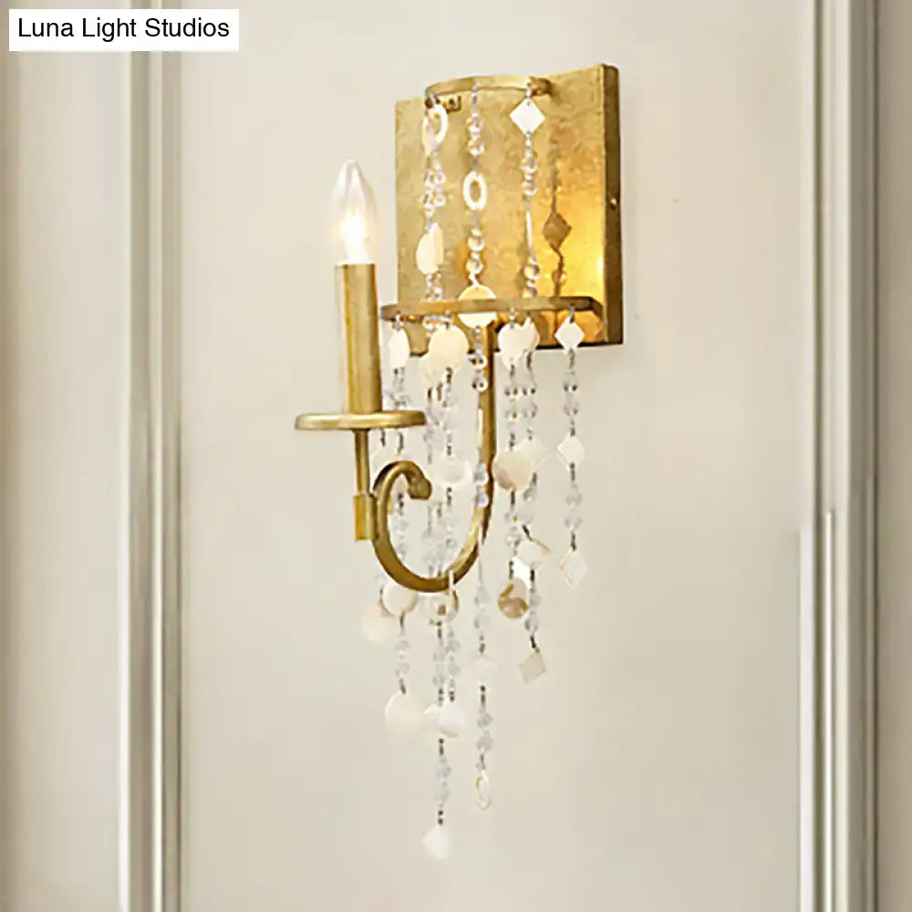 Vintage style gold wall sconce with crystal beaded strand bedroom light