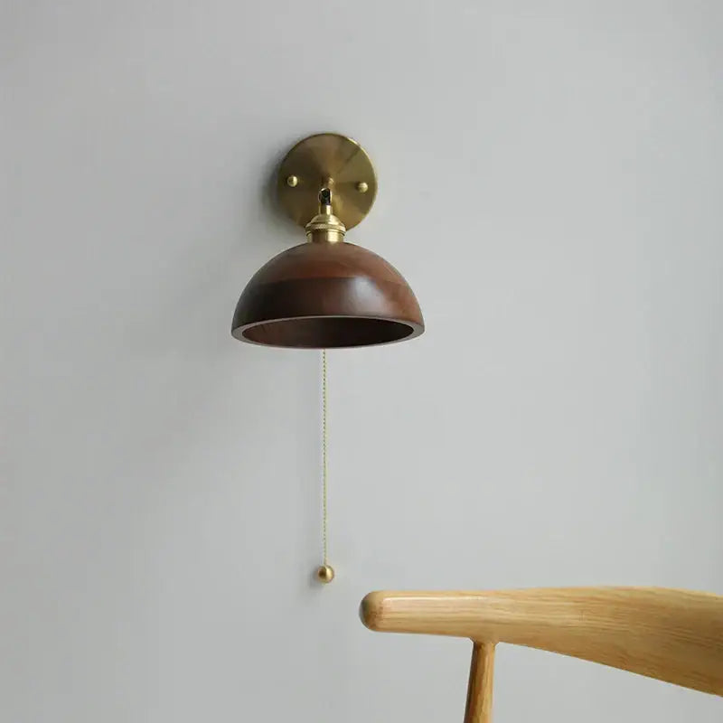 Walnut and brass wall sconce with pull chain switch bedroom light