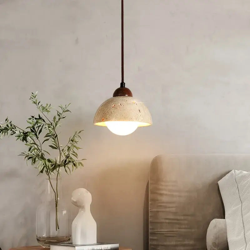 Warm textured concrete cave stone pendant light dining room