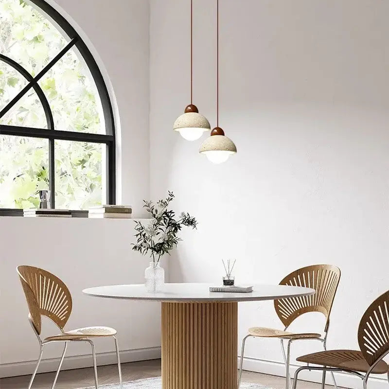Warm textured concrete cave stone pendant light dining room