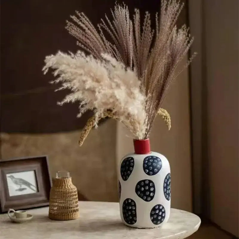 White ceramic polka dot vase with colorful graffiti lines living room
