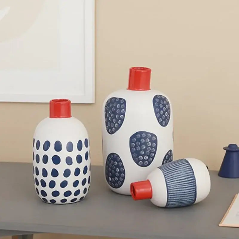 White ceramic polka dot vase with colorful graffiti lines living room