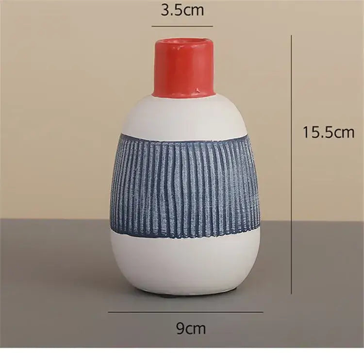 White ceramic polka dot vase with colorful graffiti lines living room