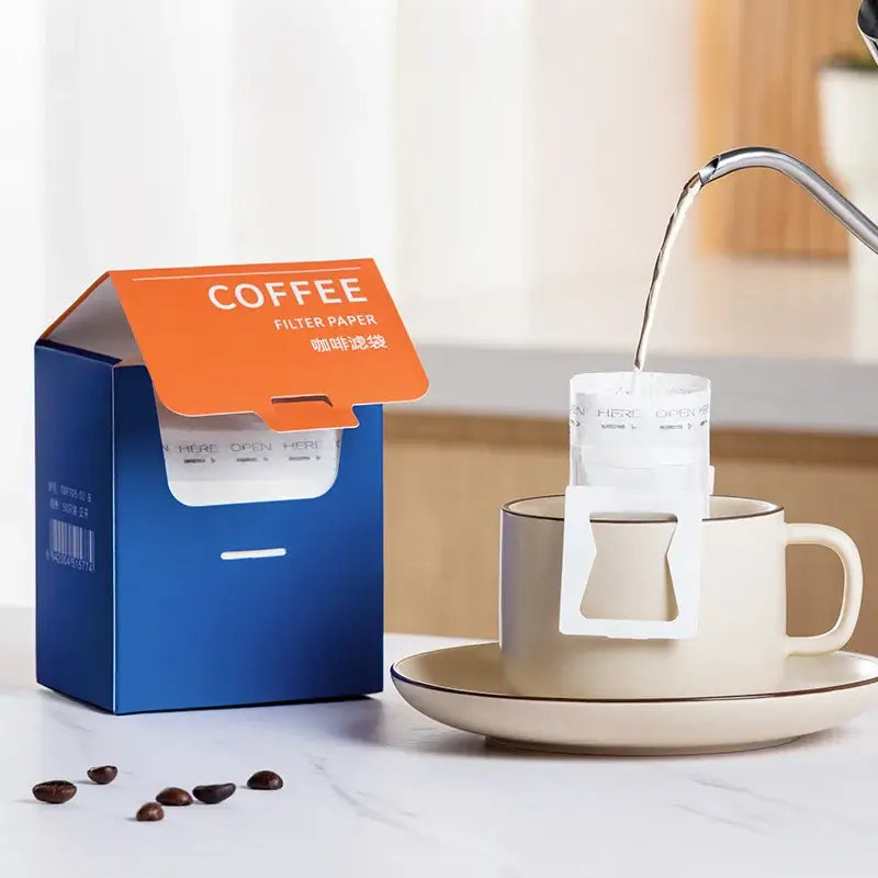 White disposable coffee filter bags kitchen pour over setup