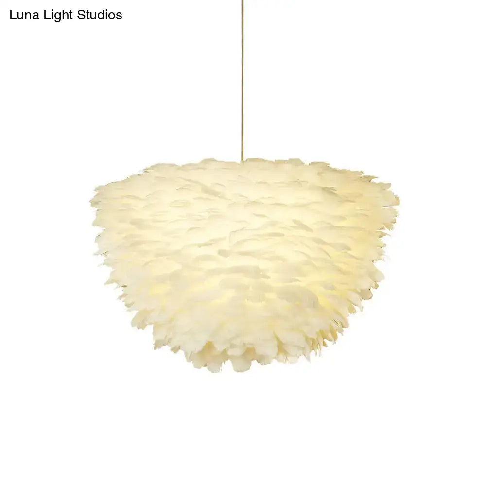 White floral pendant chandelier with feather accents for dining room