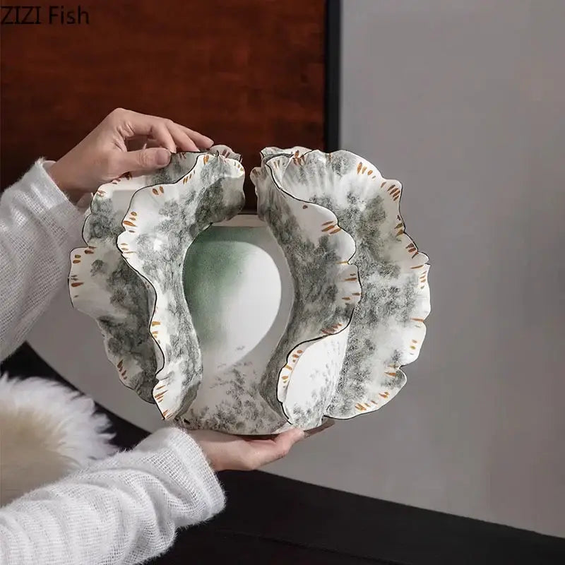 White & gray ruffled ceramic vase with artificial flowers living room