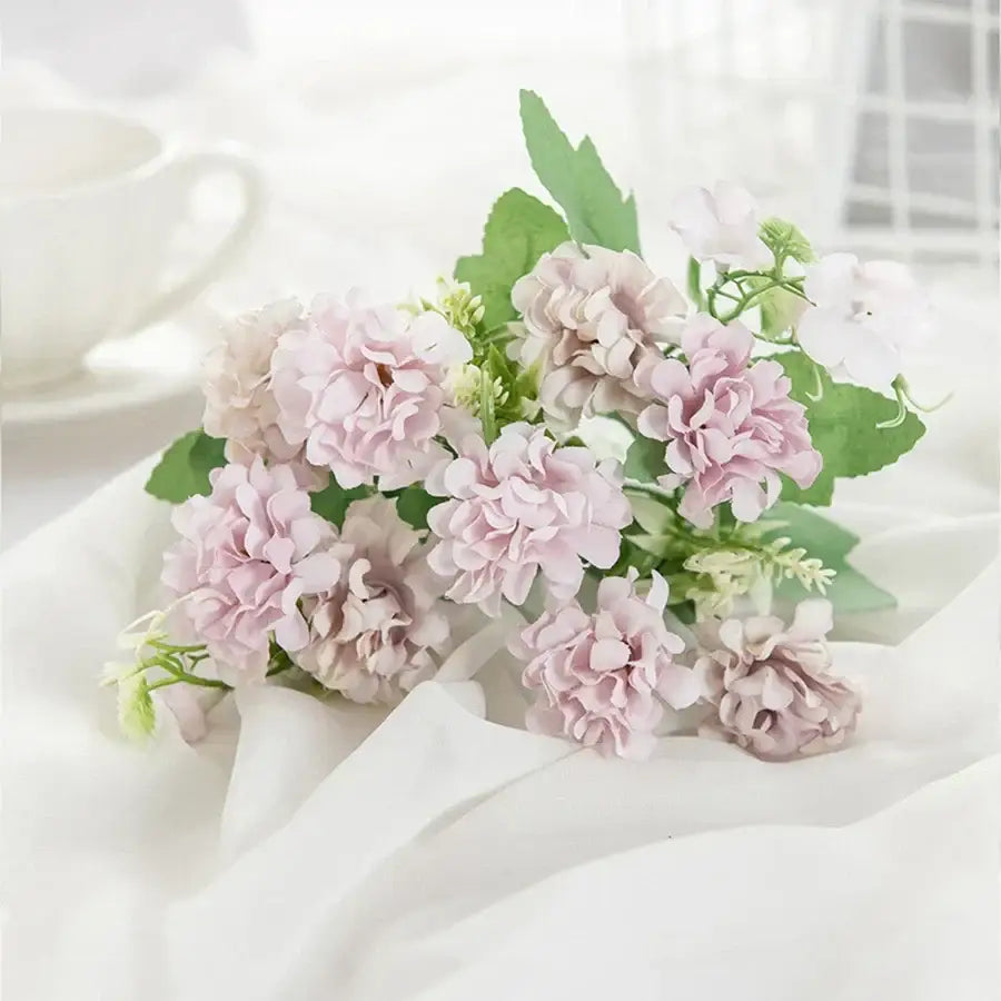 White hydrangea bouquet in ribbed glass vase for living room decor