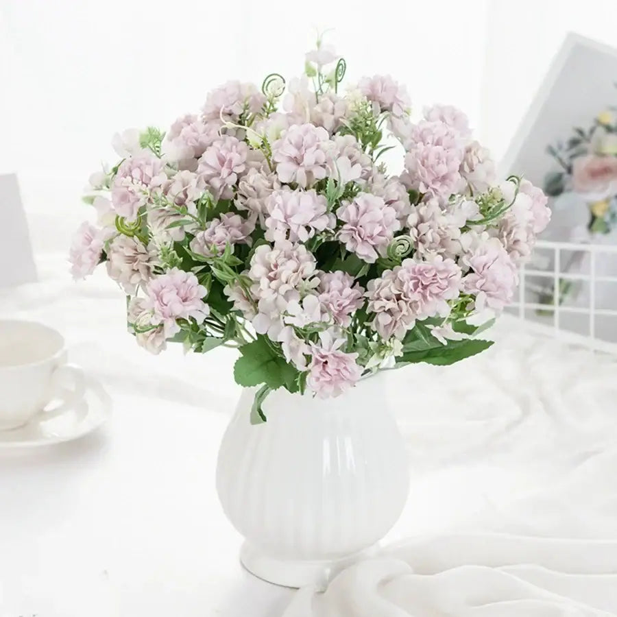 White hydrangea bouquet in ribbed glass vase for living room decor