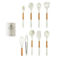 White silicone kitchen cookware set with wooden handles and holder