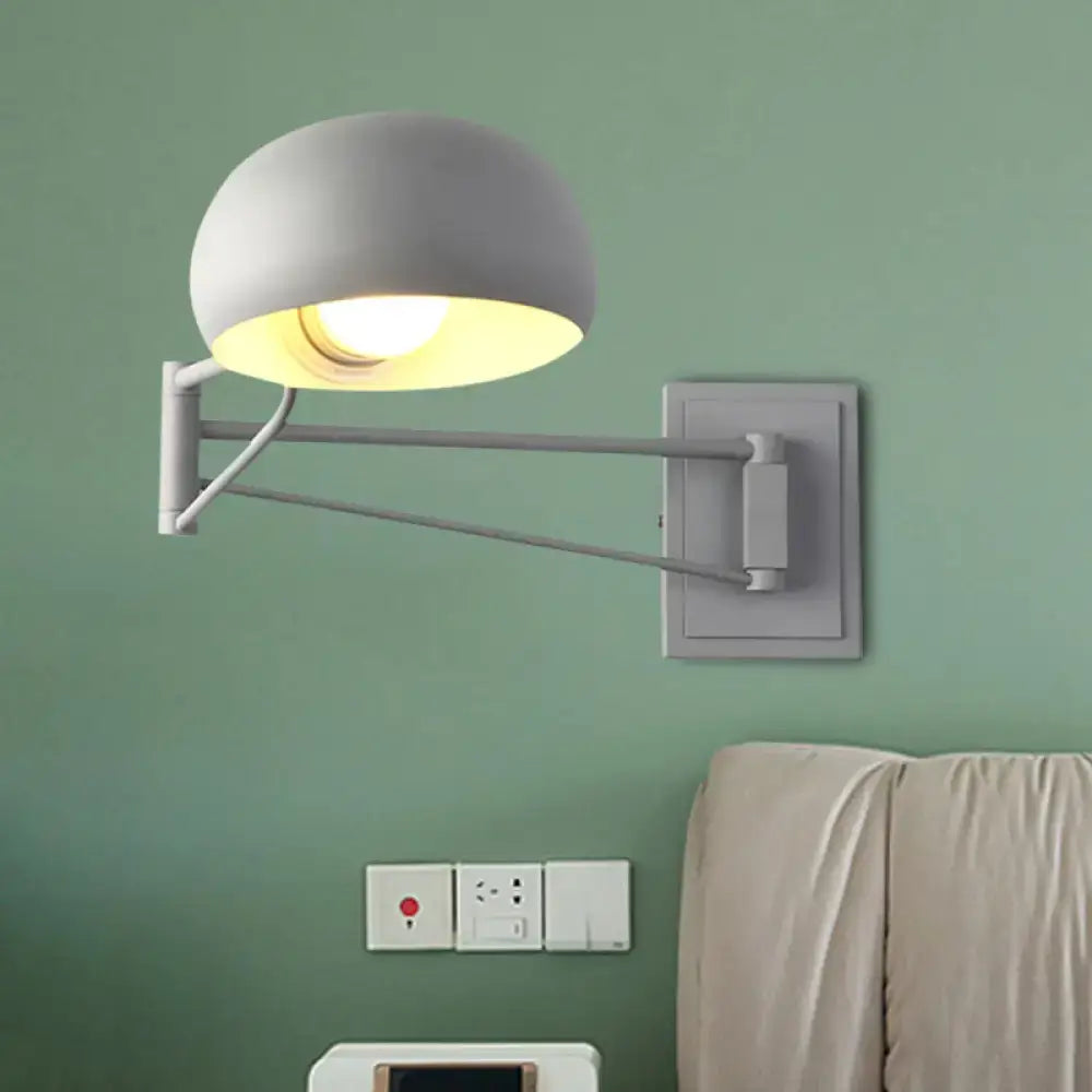 Yellow adjustable metal wall sconce with bowl shade for bedroom
