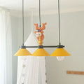 Yellow and orange monkey kitchen island pendant with yellow cone shades